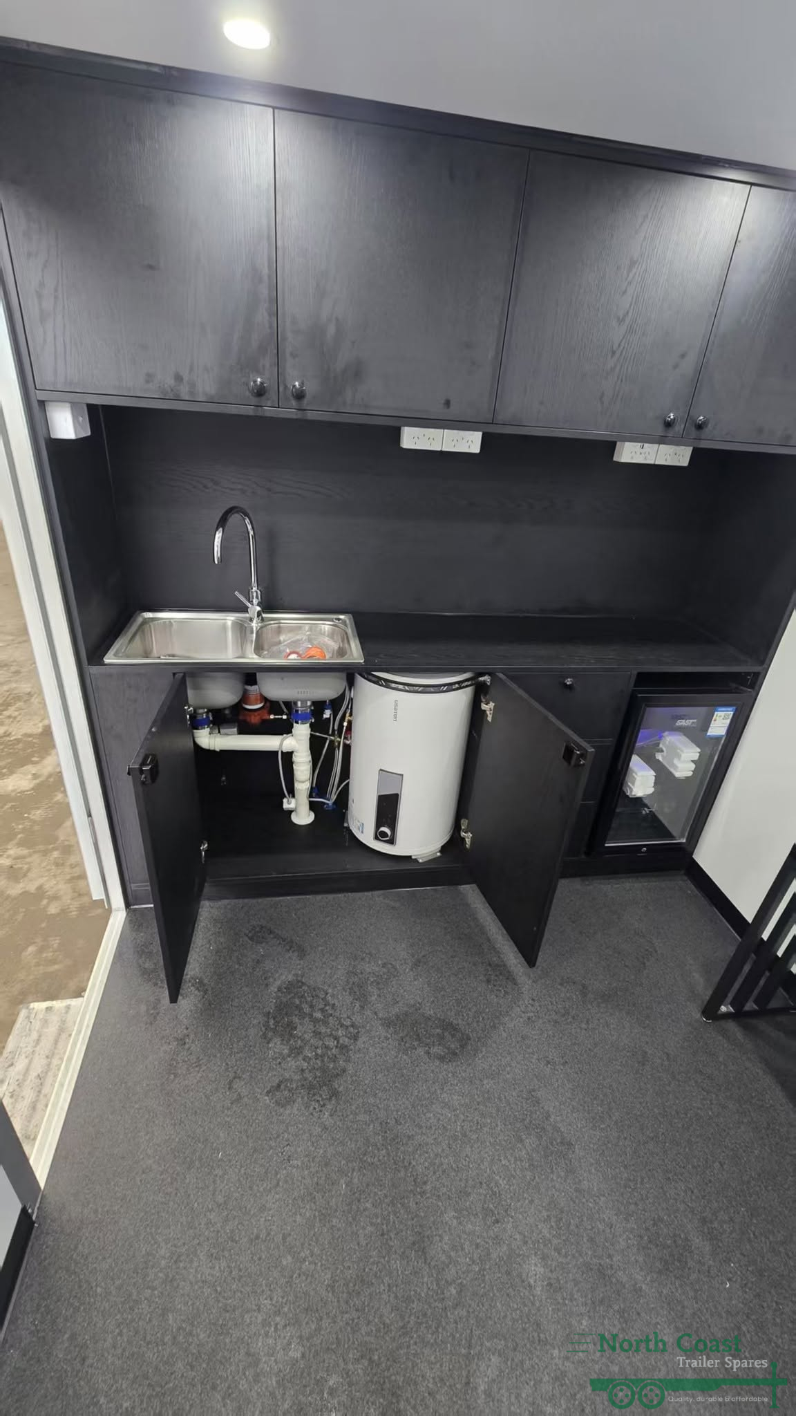 Interior of RS400 mobile barber trailer showing professional styling station and large mirror